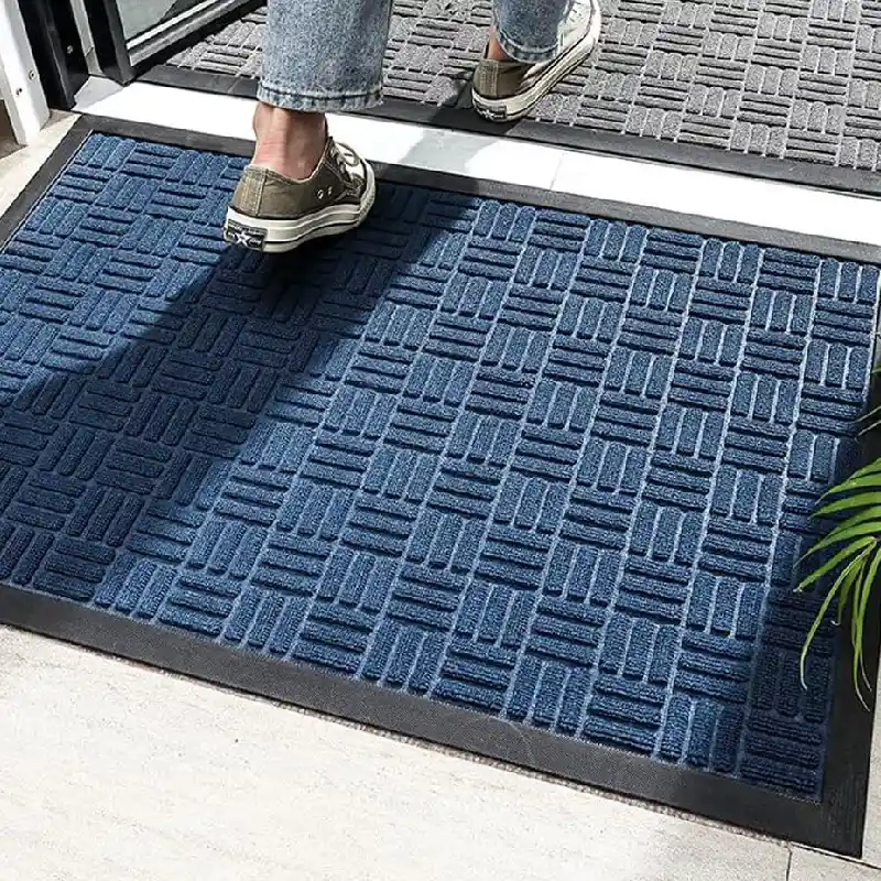 Blue textured entrance mat with geometric basket weave pattern