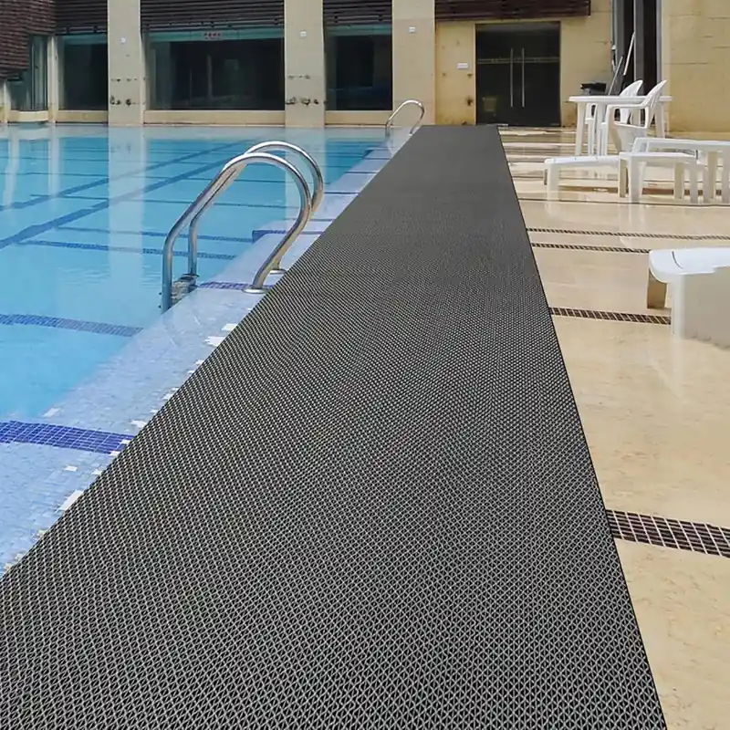 Gray non-slip mat along indoor pool edge