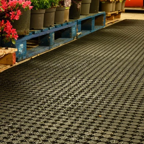 Long rubber mat path in a garden center or greenhouse